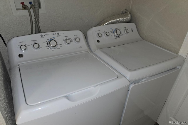 1920 Elmira St, Aurora, CO 80010 - laundry area with separate washer and dryer and a textured wall