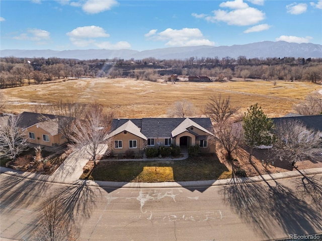 birds eye view of property with a mountain view