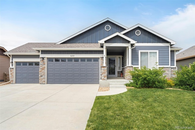 577 Tristan Pl, Berthoud, CO 80513 - craftsman-style house featuring an attached garage, stone siding, board and batten siding, concrete driveway, and a front yard