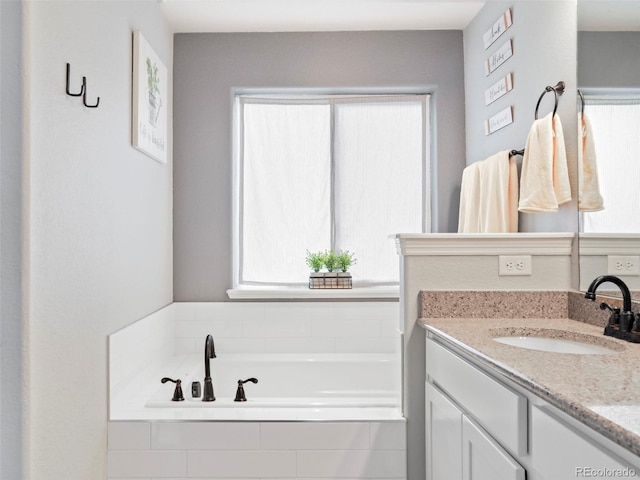 577 Tristan Pl, Berthoud, CO 80513 - full bath featuring healthy amount of natural light, vanity, and a bath