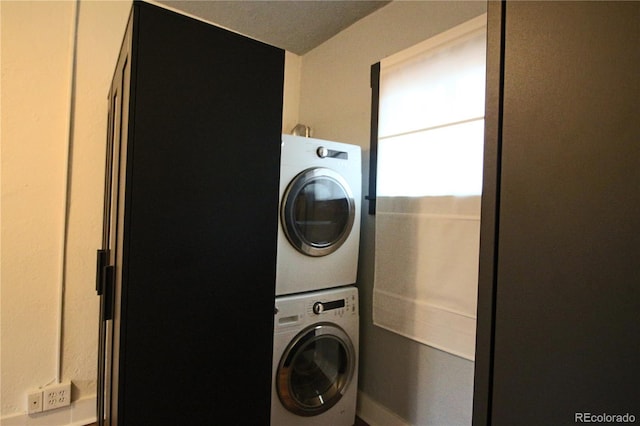 laundry room featuring stacked washer / dryer