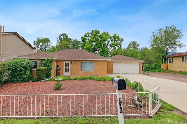 305 W Brookside St, Colorado Springs, CO 80905 - ranch-style house featuring stucco siding, concrete driveway, a detached garage, and a shingled roof