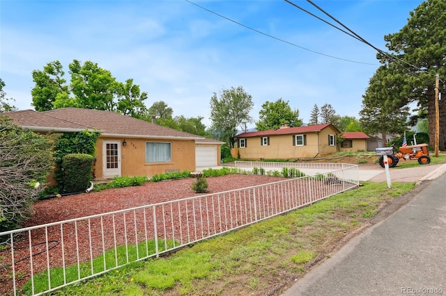 305 W Brookside St, Colorado Springs, CO 80905 - single story home with driveway and stucco siding