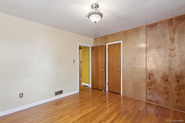 305 W Brookside St, Colorado Springs, CO 80905 - unfurnished bedroom with light wood-style floors and a closet