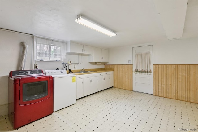 305 W Brookside St, Colorado Springs, CO 80905 - washroom featuring washer and clothes dryer, cabinet space, wainscoting, wood walls, and light floors