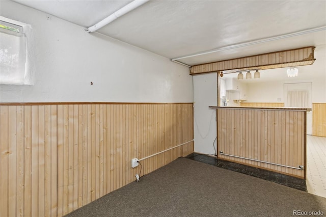 305 W Brookside St, Colorado Springs, CO 80905 - basement with wooden walls, wainscoting, carpet flooring, and bar area