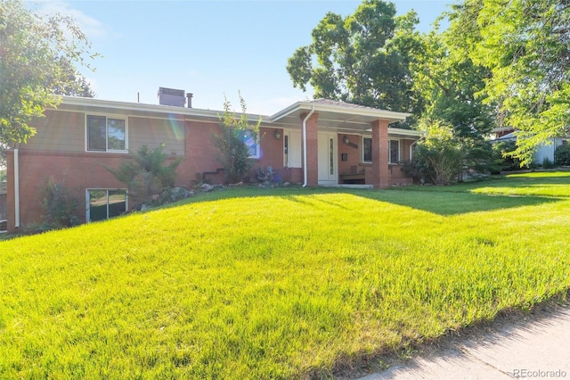 7930 S Kendall Ct, Littleton, CO 80128 - ranch-style house featuring brick siding, a front yard, and covered porch