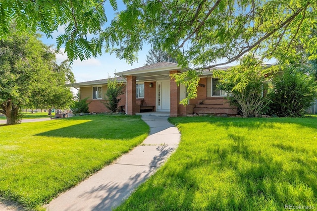 7930 S Kendall Ct, Littleton, CO 80128 - ranch-style house with a front lawn and brick siding