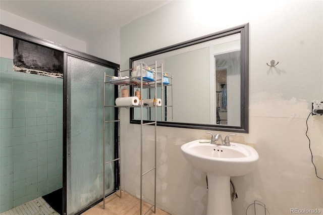 7930 S Kendall Ct, Littleton, CO 80128 - bathroom with a shower with shower door and tile patterned floors