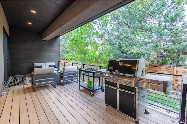 deck with an outdoor hangout area and grilling area