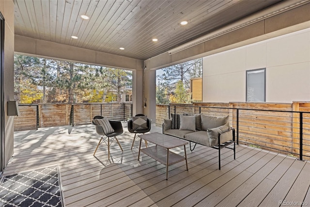 sunroom featuring wooden ceiling