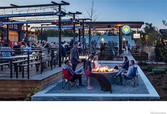 view of property's community with an outdoor fire pit