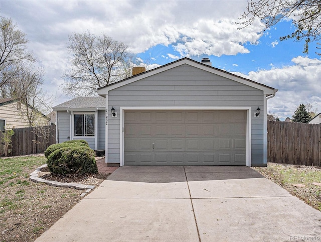 ranch-style home featuring a garage, fence, driveway, and a chimney