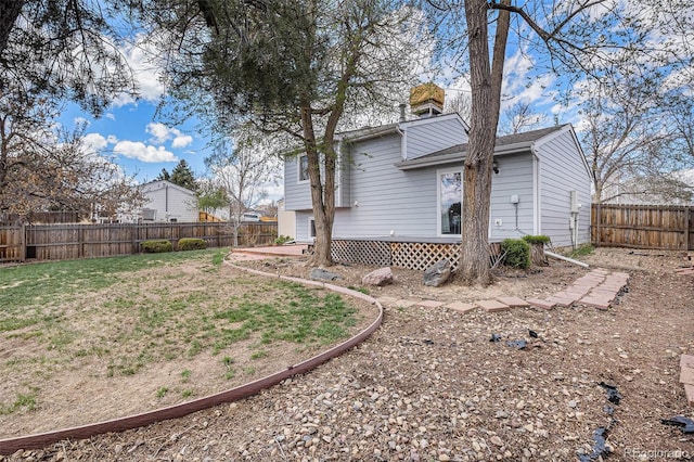 view of yard with a fenced backyard