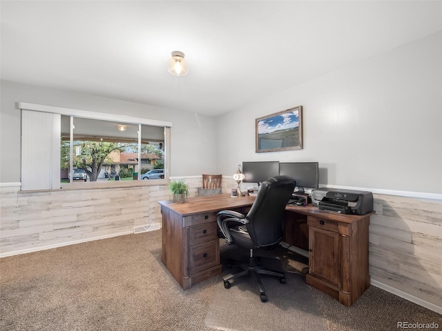 carpeted office space featuring baseboards