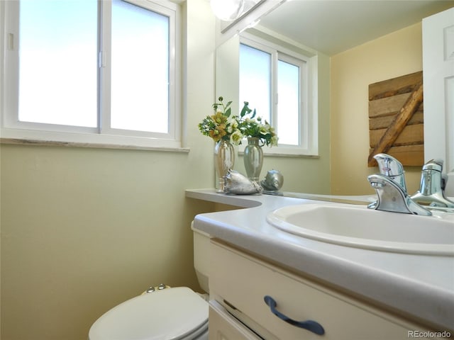 half bath with vanity and toilet