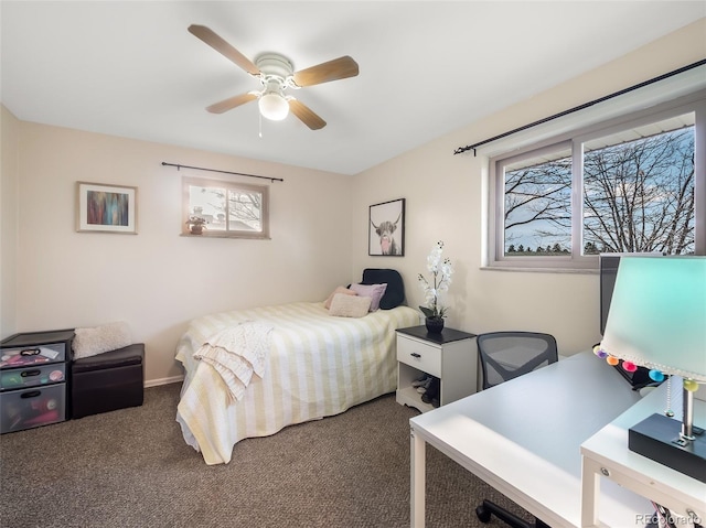 carpeted bedroom featuring a ceiling fan and multiple windows