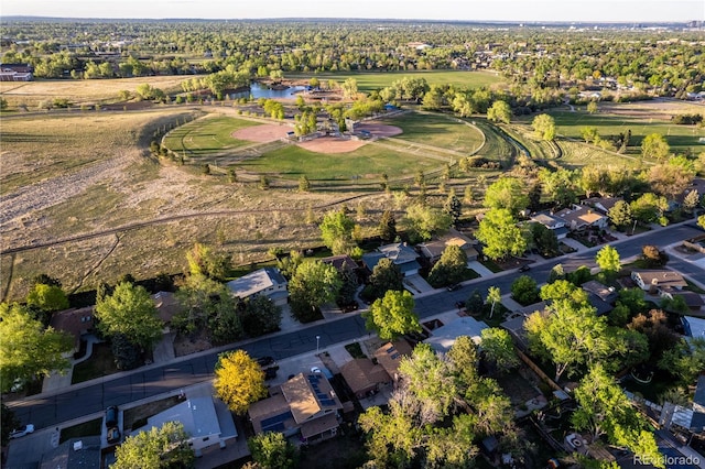 drone / aerial view featuring a residential view and a water view