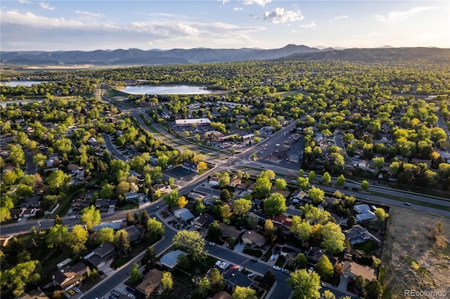 aerial view with a water and mountain view and a residential view