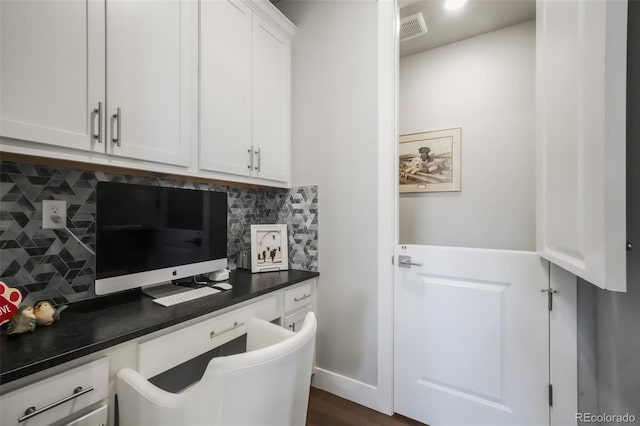 home office with built in study area and visible vents