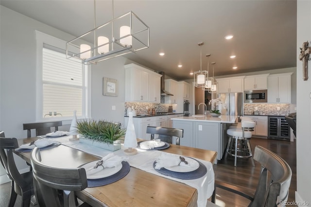 dining space featuring wine cooler, dark wood-style flooring, and recessed lighting