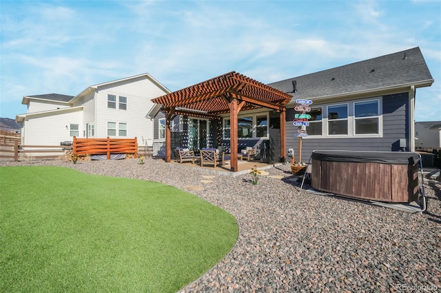 back of house with fence, a patio, a hot tub, and a pergola