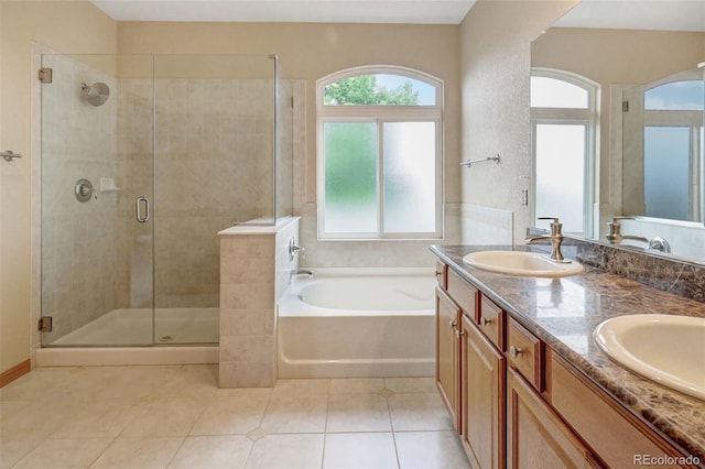 16231 Rayburn St, Hudson, CO 80642 - full bath with a garden tub, a shower stall, tile patterned floors, and double vanity