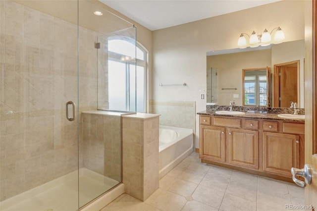 16231 Rayburn St, Hudson, CO 80642 - full bathroom featuring a stall shower, healthy amount of natural light, a bath, and double vanity