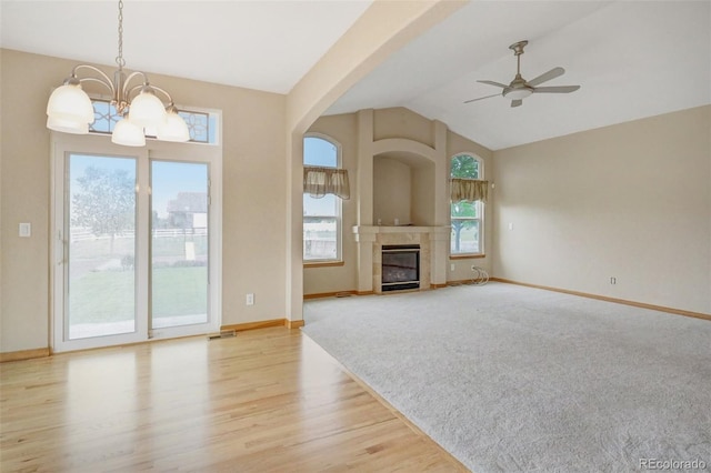 16231 Rayburn St, Hudson, CO 80642 - unfurnished living room with a chandelier, healthy amount of natural light, ceiling fan, baseboards, and vaulted ceiling
