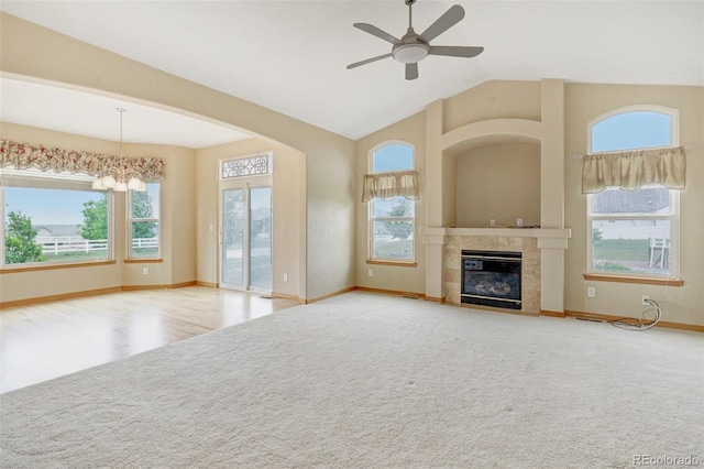 16231 Rayburn St, Hudson, CO 80642 - unfurnished living room with healthy amount of natural light, carpet flooring, baseboards, ceiling fan, and vaulted ceiling