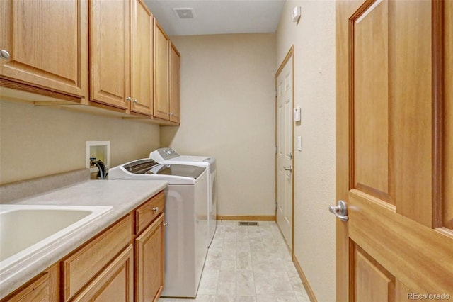 16231 Rayburn St, Hudson, CO 80642 - washroom featuring cabinet space, washer and dryer, and baseboards