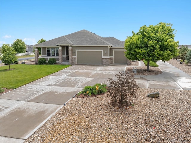 16231 Rayburn St, Hudson, CO 80642 - view of front of house featuring an attached garage, a front lawn, concrete driveway, and roof with shingles