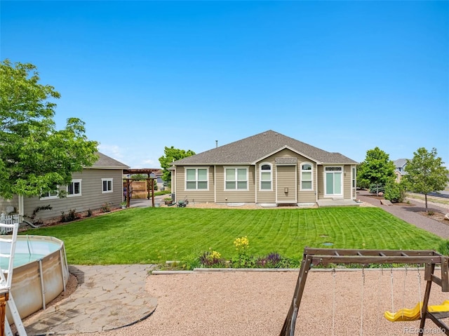 16231 Rayburn St, Hudson, CO 80642 - back of property with a pergola and a lawn