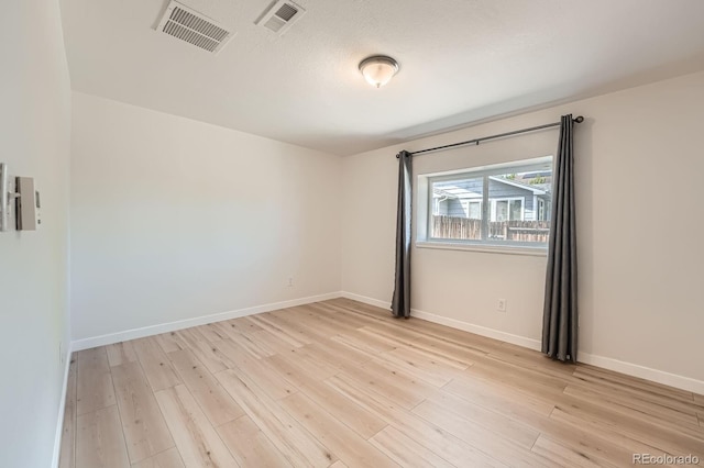 1533 E Harlan, Lakewood, CO 80214 - empty room with light wood-style floors and baseboards