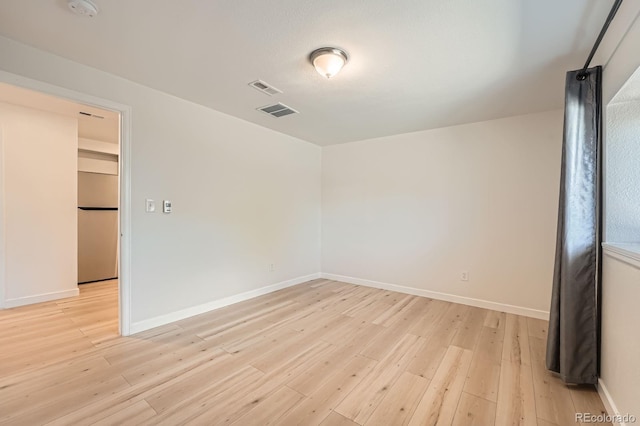 1533 E Harlan, Lakewood, CO 80214 - empty room with light wood-type flooring and baseboards