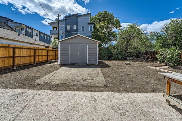 1533 E Harlan, Lakewood, CO 80214 - rear view of property featuring a shed, an outbuilding, and a fenced backyard