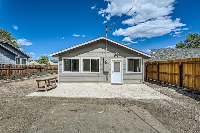 1533 E Harlan, Lakewood, CO 80214 - rear view of property with a patio area and a fenced backyard
