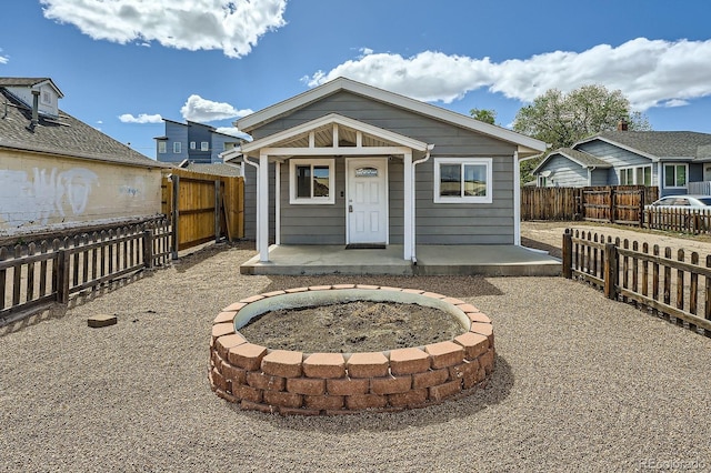1533 E Harlan, Lakewood, CO 80214 - back of house with a fenced backyard and a porch