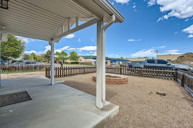 1533 E Harlan, Lakewood, CO 80214 - view of patio / terrace featuring a fenced backyard and a residential view