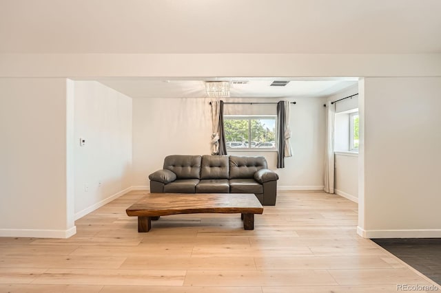 1533 E Harlan, Lakewood, CO 80214 - living room featuring light wood-style floors and baseboards