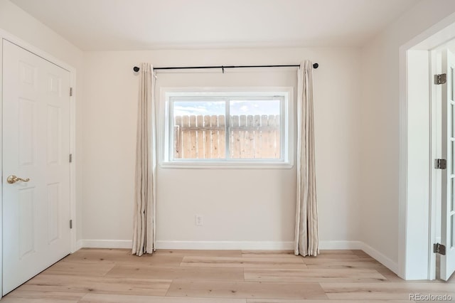 1533 E Harlan, Lakewood, CO 80214 - unfurnished bedroom with light wood-style flooring and baseboards