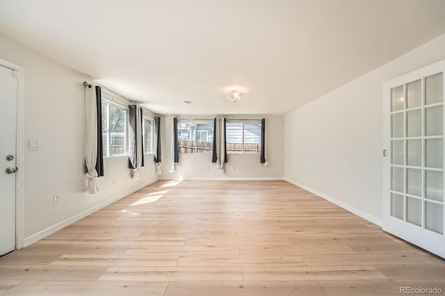 1533 E Harlan, Lakewood, CO 80214 - unfurnished room with light wood-type flooring and baseboards