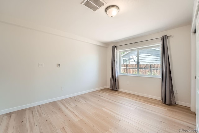 1533 E Harlan, Lakewood, CO 80214 - unfurnished room with light wood-style flooring and baseboards