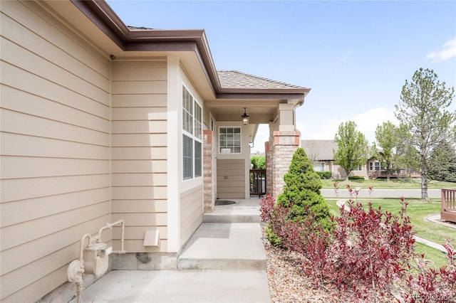 6193 Terry Ct, Arvada, CO 80403 - view of exterior entry featuring a shingled roof