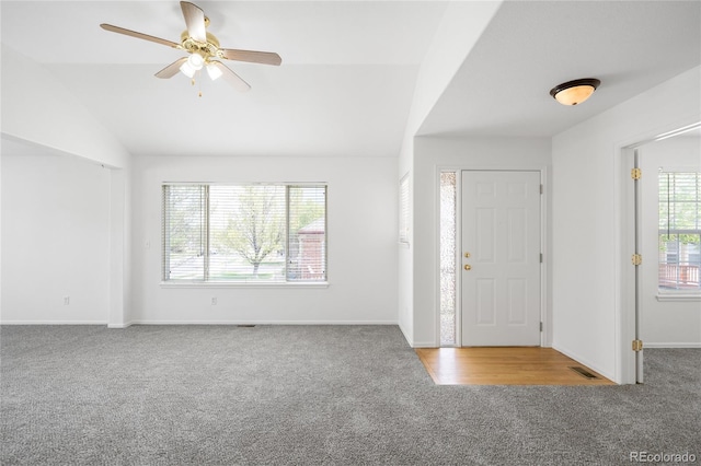 6193 Terry Ct, Arvada, CO 80403 - foyer entrance with carpet floors, ceiling fan, baseboards, and lofted ceiling