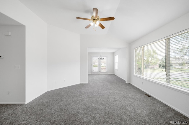 6193 Terry Ct, Arvada, CO 80403 - carpeted empty room with a chandelier, a ceiling fan, lofted ceiling, and baseboards