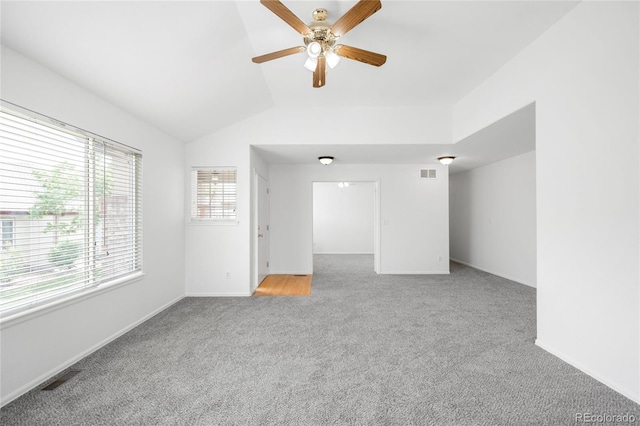 6193 Terry Ct, Arvada, CO 80403 - unfurnished living room featuring carpet flooring, ceiling fan, vaulted ceiling, and baseboards