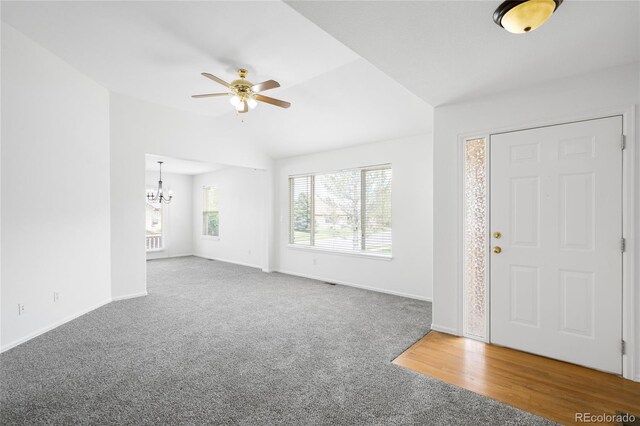 6193 Terry Ct, Arvada, CO 80403 - carpeted foyer with a chandelier, a ceiling fan, baseboards, and vaulted ceiling