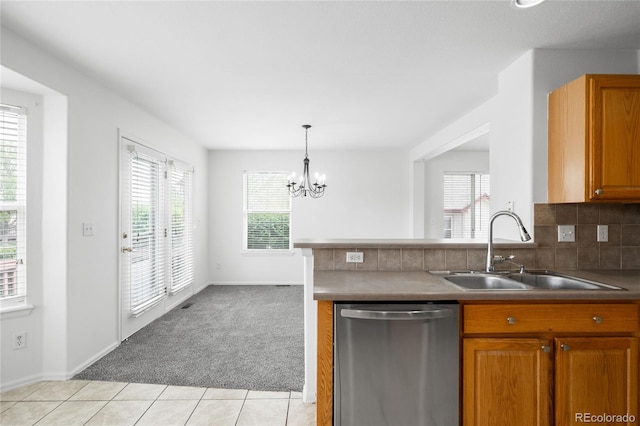 6193 Terry Ct, Arvada, CO 80403 - kitchen with dishwasher, a sink, plenty of natural light, and light tile patterned floors