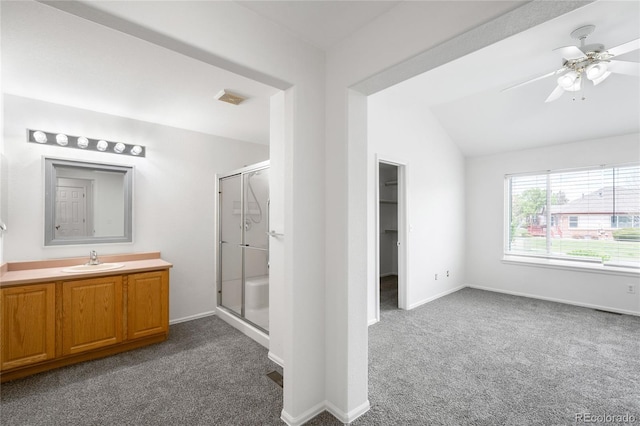 6193 Terry Ct, Arvada, CO 80403 - bathroom featuring a shower stall, lofted ceiling, carpet floors, vanity, and a ceiling fan